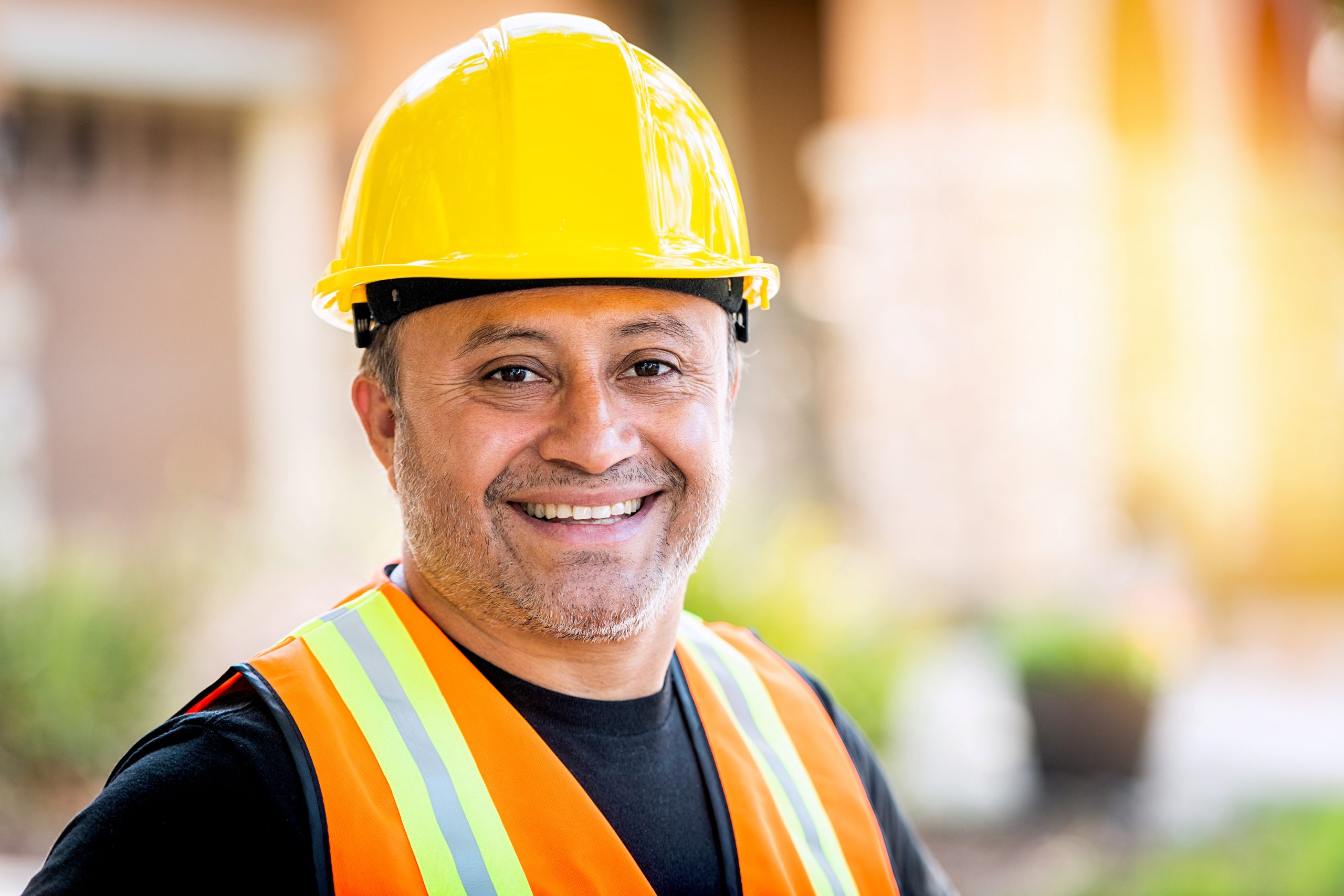 Woman construction worker standing with arms crossed